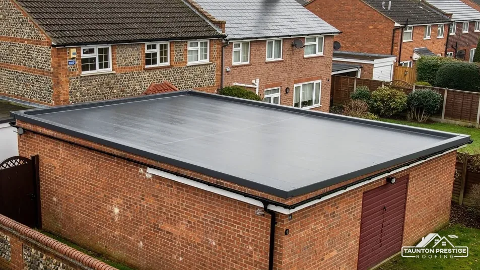Brick garage with a new black rubber flat roof