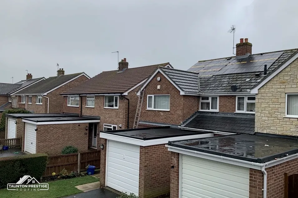 Brick semis with concrete tile roofs and flat-roofed garages
